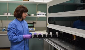 Kirsten Bloxham, Specialist Biomedical Scientist, operating the Roche Cobas HPV analyser, used to detect the presence of the human papilloma virus in cervical smears.