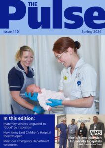 The Pulse cover featuring two midwives smiling at a baby