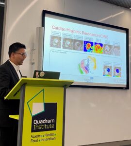 Dr Garg presenting his work on a big screen