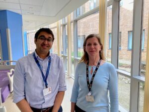 Dr Farasat Kazim and Dr Jenny Nobes at the Norfolk and Norwich University Hospital standing in the hospital corridor