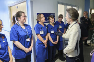 The Princess Royal meets a group of midwives standing in a line