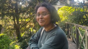 Abeeda Khatun stood smiling outside amongst trees